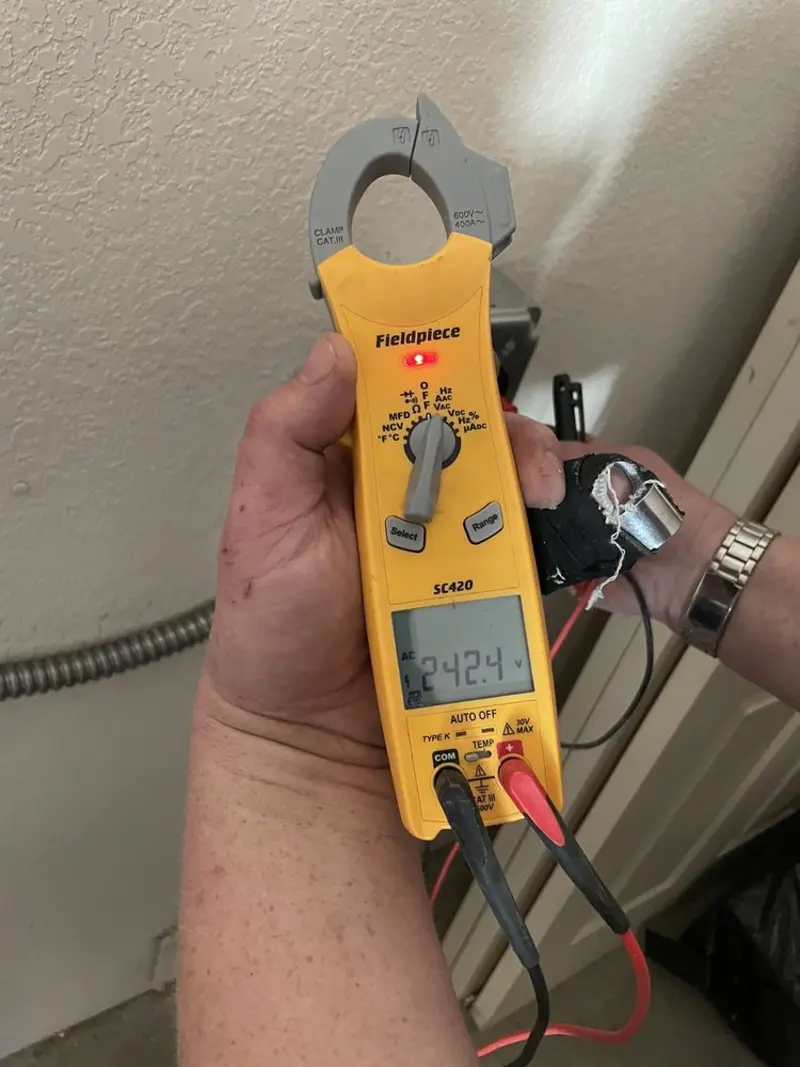 Voltage testing with clamp meter during Electrical Installation Services in Bar Nunn